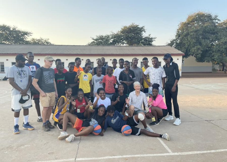 Victoria Falls basketball players and supporters together on the court